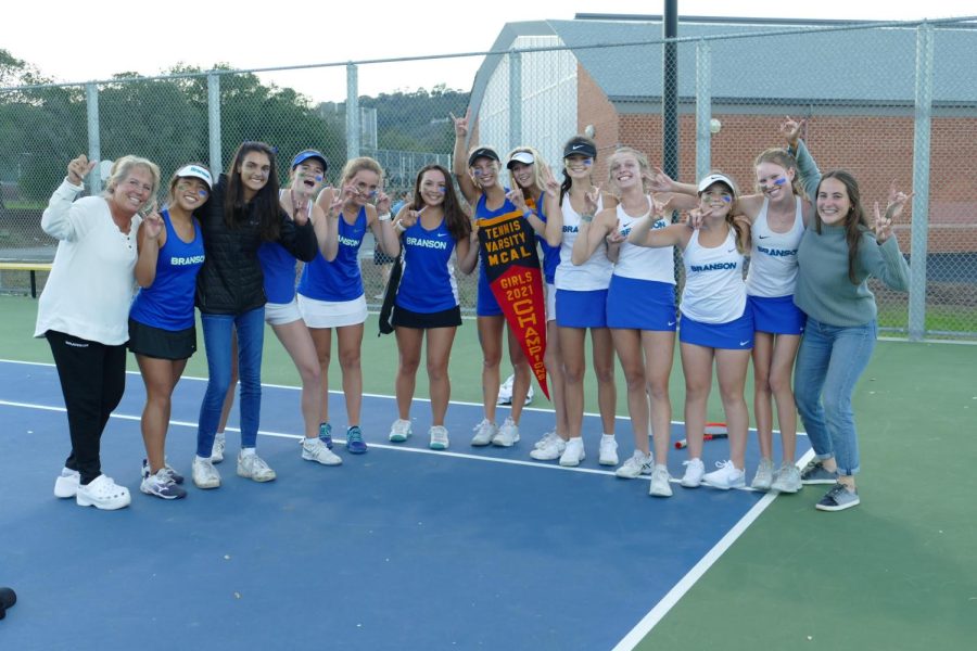 The girls tennis team, seen here
after its MCAL victory, has won
several titles this year. (Courtesy of Bo Arlander)