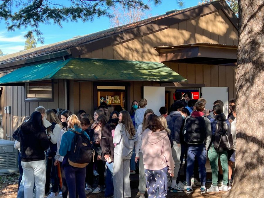 Students gather around the Snack Shack in January 2022. The campus store reopened after a pandemic hiatus.