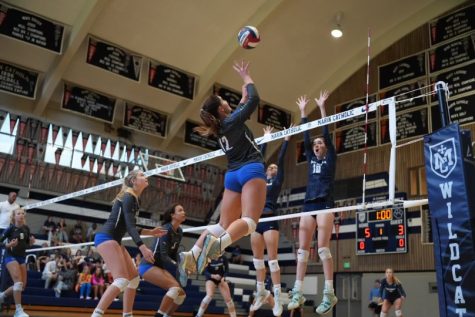 Eva Lacy jumps for a shot against Marin Catholic, Sept. 20, 2022. Branson girls varsity volleyball faces the school in Kentfield for its second league game this season.