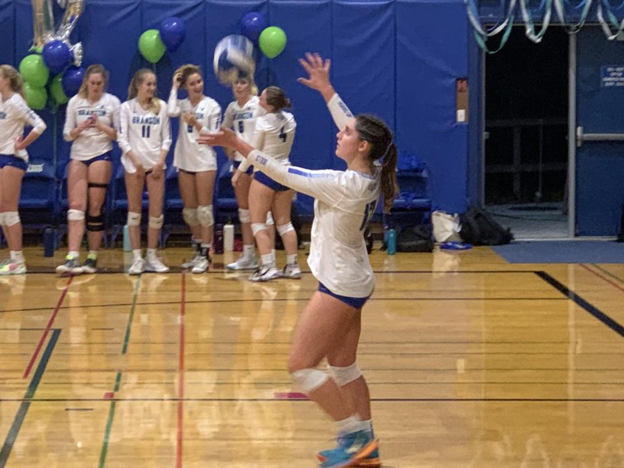 Eva Lacy, a senior, serves the ball against San Rafael at home, Oct. 12, 2022. Senior night ended with a decisive win against the MCAL opponent.