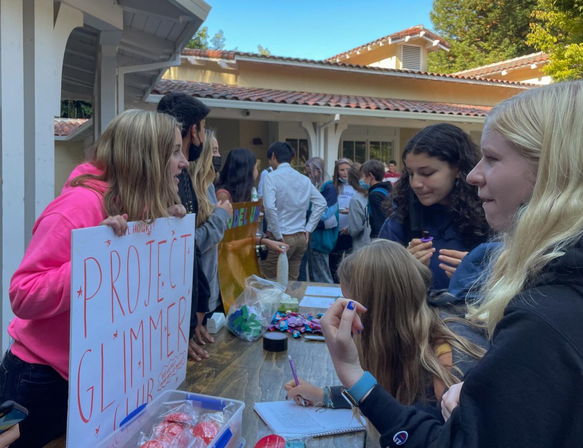 At the schools club fair, students browse various booths. The annual event is an opportunity for students to learn about extracurricular activities available on campus.