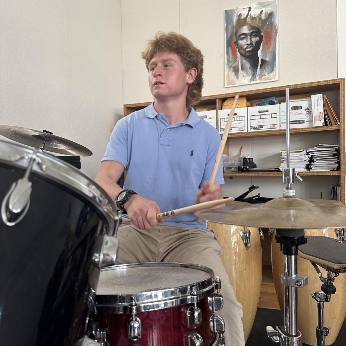 Cyrus Allen ‘25, plays the drums. Allen and the band have been building their repertoire for their first performance.