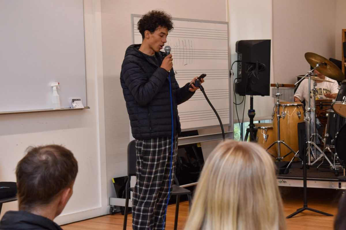 Joaquin Aguillon 24 recites poetry at Bransons WORD open mic event. The session took place on November 16th, showcasing student literary works.