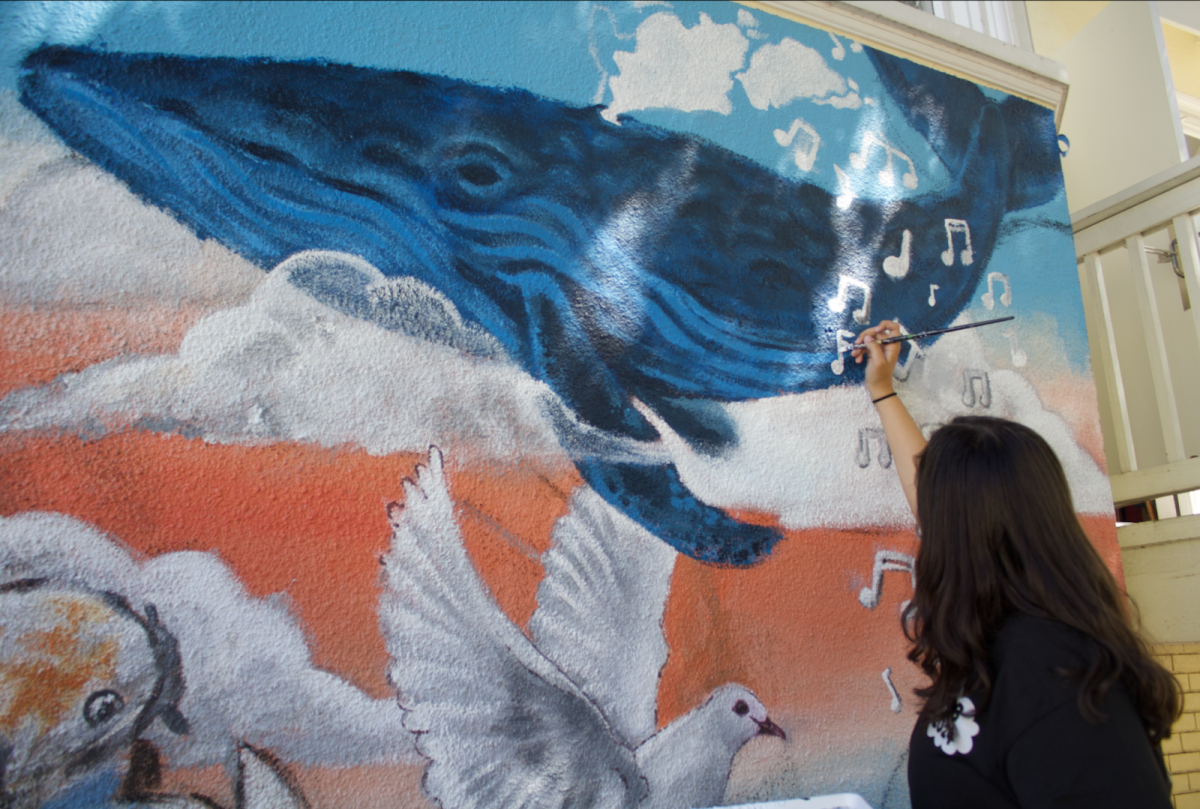 Natalia Rincon ‘27 paints a mural on New House during FAB. FAB is a celebration of students in the arts at Branson.