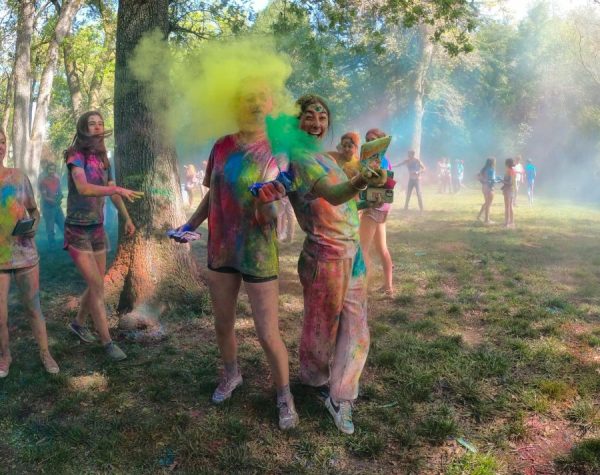 Students participate in Holi by throwing colored chalk powder. Holi, the Indian festival of color and light, was introduced to the Branson campus in 2022.