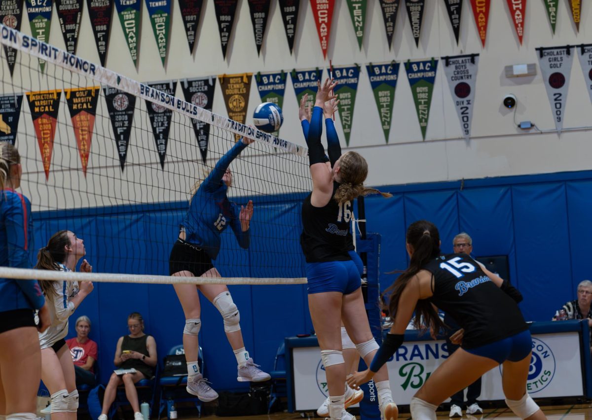 Ellie Corsello '26 jumps to block an attack from the Tam Falcons. Girls volleyball is off to an impressive start in their season and is aiming high for the upcoming MCAL tournament even without some key players from last year.