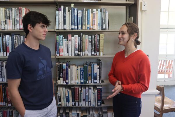 Reese Furhman '25 (right) talks with another student. Furhman founded the Branson Political Review last school year to help foster constructive political conversation on campus.