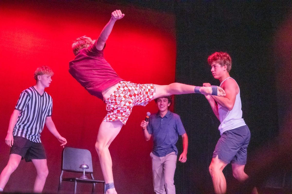 Drew Holden and Jonah Sher stage-fight during their WWE-inspired wrestling act.