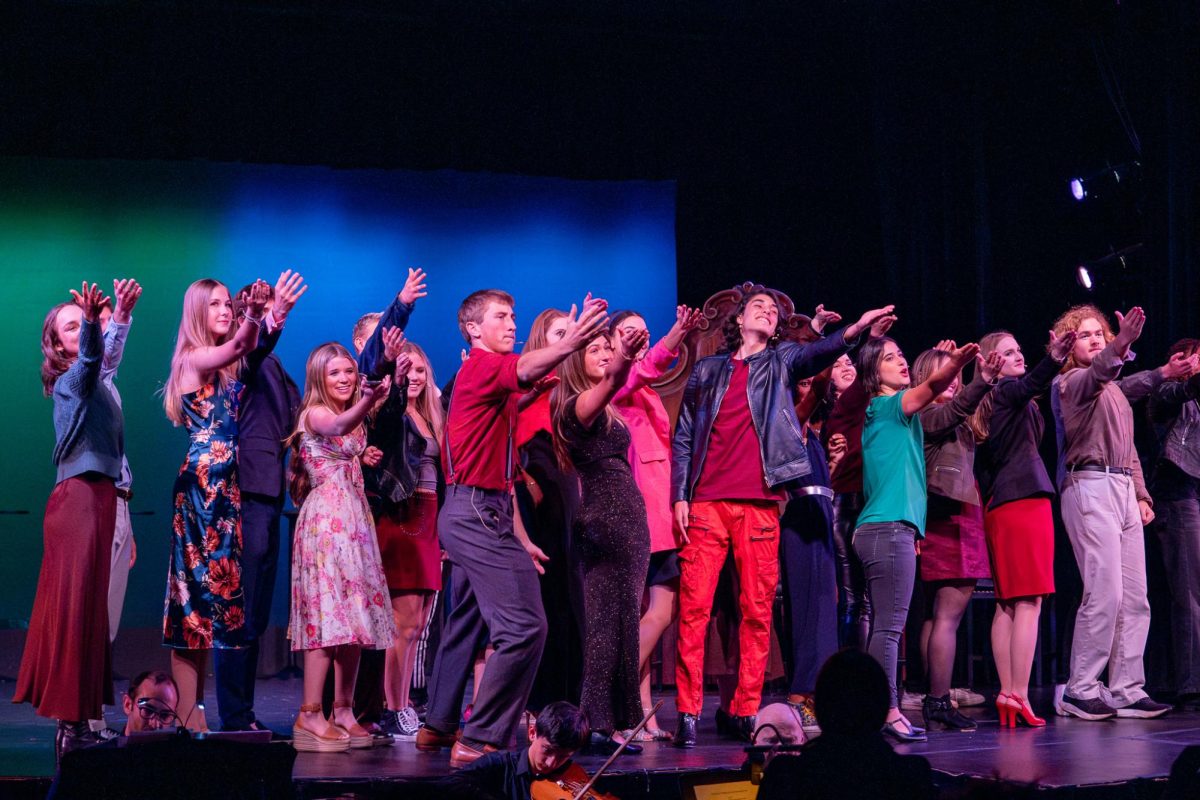 Actors reach out to the audience at the end of the show. Branson theater debuted an original musical, 'The Devil's Dating Service,' this fall.