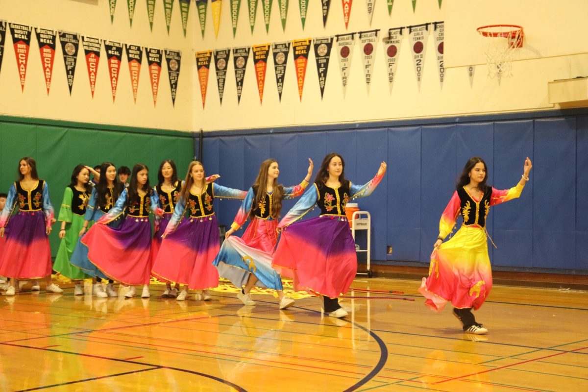 Students from Branson Mandarin classes perform Xinjiang, a traditional Chinese dance, during their Lunar New Year performance.