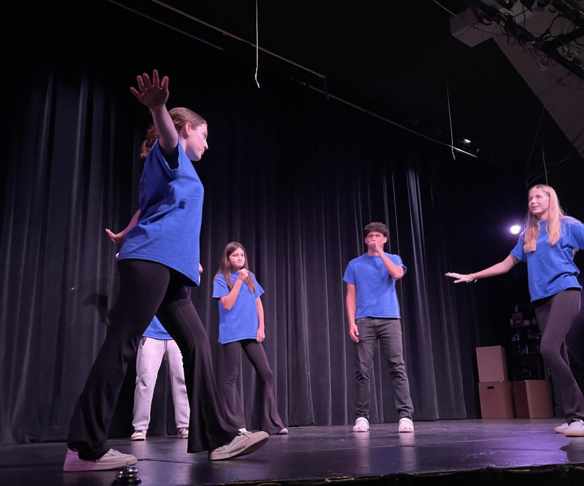 The Blue Team performs in an improv game. TheaterSports is an annual improv competition bringing together students from all Branson acting classes.