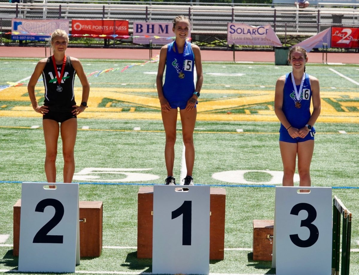 Farah Allen ‘27 (middle) and Hailey
Sellers ‘27 (right) stand on the
podium.