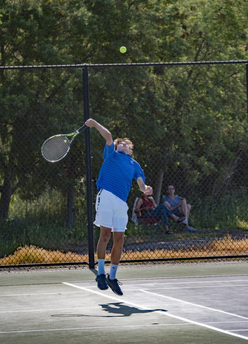 Gian-Carlo '28 serves against opponent in MCAL semifinals.