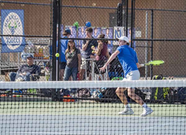 Finn Higgins '27 plays singles match against MC. The Bulls moved on to play Redwood in the finals.